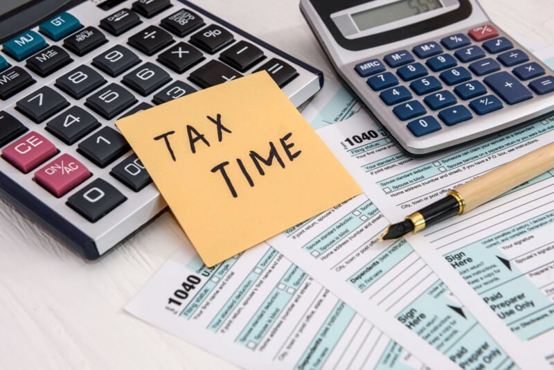 Person getting ready to do their taxes and wondering about writing off and deducting credit card fees and interest on their business taxes.